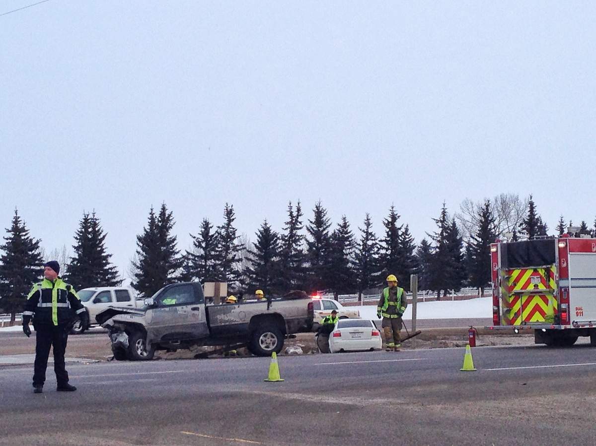 Emergency crews investigate a crash on the Trans-Canada Highway just east of Chestermere on Wednesday, January 29, 2014.