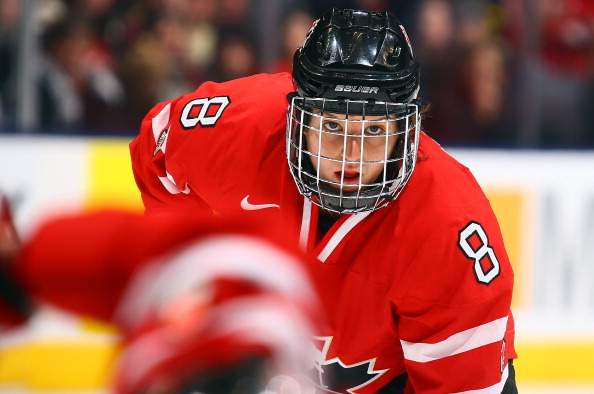 Laura Fortino #8 of Team Canada waits for a face-off against Team USA during a Sochi preparation game at the Air Canada Centre December 30, 2013 in Toronto.