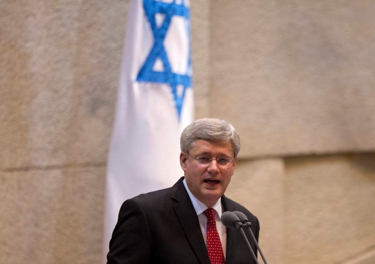 Prime Minister Stephen Harper speaks at the Knesset, Israel's Parliament in Jerusalem, Monday, Jan. 20, 2014. (AP Photo/Ariel Schalit).