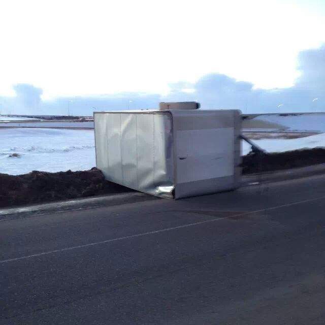 A trailer is tipped over on its side on Anthony Henday Drive reportedly by high winds, Wednesday, January 15, 2014.