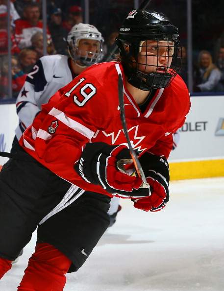 Brianne Jenner #19 of Team Canada skates up the ice of Team USA during a Sochi preparation game at the Air Canada Centre December 30, 2013 in Toronto.