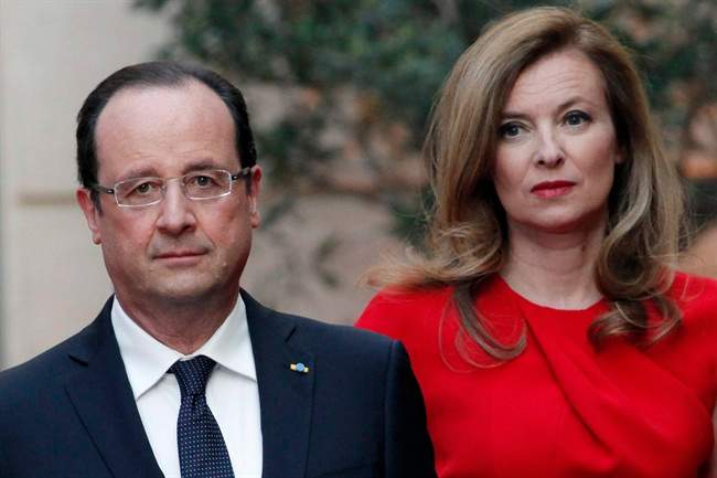 In this Tuesday, May. 7, 2013, file photo, French President Francois Hollande, left, and his companion Valerie Trierweiler arrive for a state dinner at the Elysee Palace, in Paris as part of Polish President Bronislaw Komorowski's two-day visit to France. 