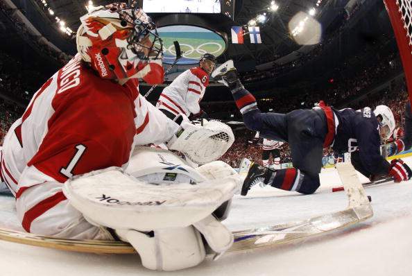 Canadian goalkeeper Roberto Luongo (1) falls into the net during the Men's Gold Medal Hockey match against the USA at the Canada Hockey Place during the XXI Winter Olympic Games in Vancouver.