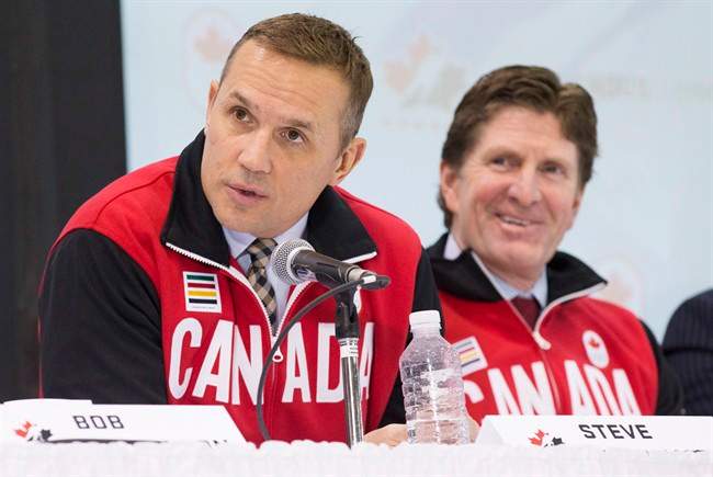 Team Canada Olympic hockey team Executive Director Steve Yzerman and head coach Mike Babcock, right, speak following the announcement of the team roster in Toronto, Tuesday January 7, 2014.