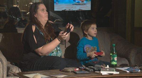 Christina Morgenstern and her son play Wii - one of the kids' favourite Christmas presents. It was one of the items that was thrown from the family's vehicle during a roll-over on Boxing Day. A kind couple from Wabamun helped pick-up the presents that were thrown from the vehicle during the rollover.