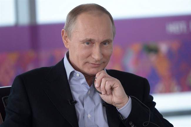 In this Friday, Jan. 17, 2014 photo made available by Presidential Press Service on Sunday, Jan. 19, 2014, Russian President Vladimir Putin, listens during an interview to Russian and foreign media at the Russian Black Sea resort of Sochi, which will host Winter Olympic Games on Feb. 7, 2014. 