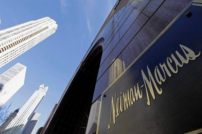 FILE - In this Wednesday, March 11, 2009 file photo, the Chicago skyline is reflected in the exterior of Neiman Marcus on Michigan Avenue in Chicago. 