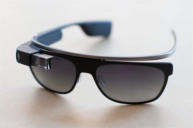 The new Google Glass "Classic" sunglass frames in "charcoal" color rests on a table at the Google Glass Basecamp space at Chelsea Market, Friday, Jan. 24, 2014, in New York.