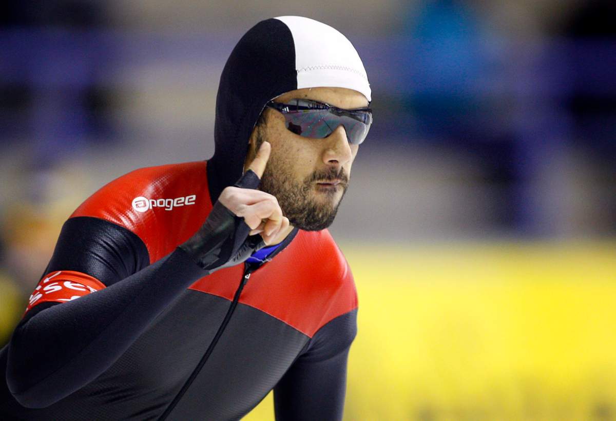 Muncef Ouardi, from Montreal, Que., celebrates setting the third fastest time during the men's ISU World Speed Skating Sprint Championship 500-metre event  in Calgary, Alta., Saturday, Jan. 28, 2012.