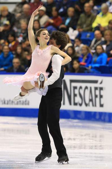 SAINT JOHN, NB - OCTOBER 25:  Alexandra Paul (L) and Mitchell Islam of Canada skate during the ice dance short program at the ISU GP 2013 Skate Canada International at Harbour Station on October 25, 2013 in Saint John, New Brunswick, Canada.