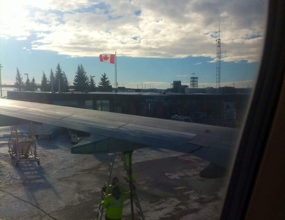 A passenger’s view from inside an Air Canada flight diverted to Brandon Manitoba due to bad weather in Winnipeg on Wednesday, Jan. 15, 2014 were also smaller aircraft belonging to Calm Air and Perimeter Aviation.