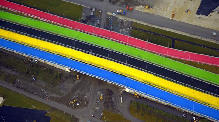 A picture taken from a helicopter on December 22, 2013, shows roads under construction at the Olympic Park in the Russian Black Sea resort of Sochi. The Olympic Park will be able to accommodate about 75000 visitors when full, and all the ice arenas will be within walking distance of one other. (Photo credit: Getty Images)