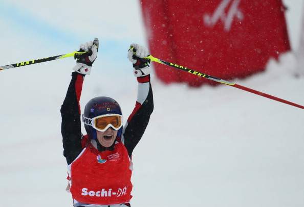 Canadian Kelsey Serwa celebrates her victory on the finish line during the Ladies' Ski Cross final race at the Snowboarding and Free Style World Cup Test Event at the Snowboard and Free Style Center in Rosa Khutor near the Russian Black Sea resort of Sochi on February 19, 2013. 