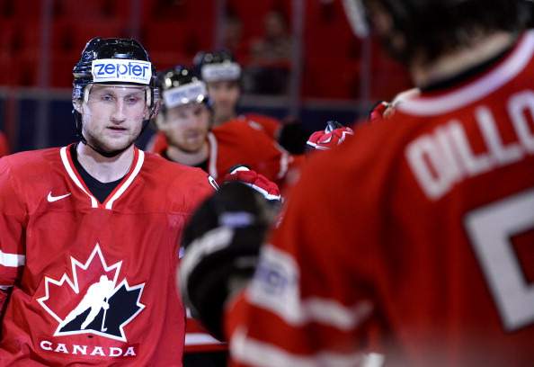 Canada's Steven Stamkos (L) celebrates with his teammates after scoring during the preliminary round match Canada vs Slovenia at the 2013 IIHF Ice Hockey World Championships on May 13, 2013 in Stockholm.
