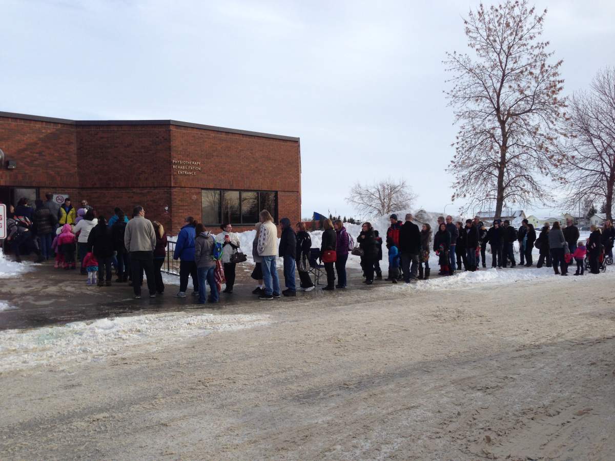 A long lineup for the flu shot in Strathmore, on Jan. 10, 2014.