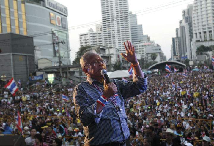Anti-government protest leader Suthep Thaugsuban speaks to his supporters Monday, Jan. 13, 2014, in Bangkok, Thailand.
