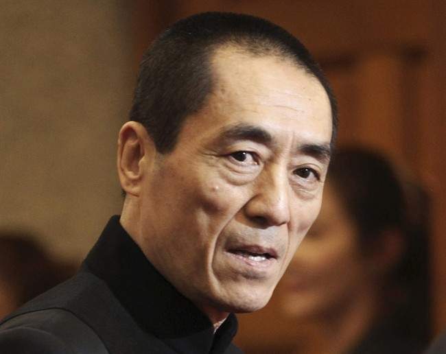 FILE - In this Tuesday, Oct. 30, 2012 file photo, Chinese director Zhang Yimou arrives to attend Daejong Film Festival in Seoul, South Korea. Zhang must pay more than $1.2 million in fines for having three children in violation of China's strict family planning rules, officials said Thursday, Jan. 9, 2014. 