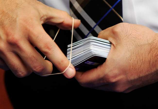 A detective collects credit cards that were confiscated by police after arresting a man and a woman on fraud charges this week in Texas. The suspects used account information stolen during the Target security breach to buy tens of thousands of dollars' worth of merchandise, Texas police allege.