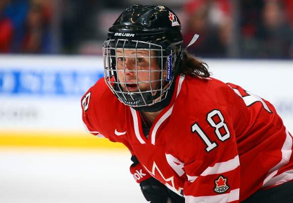 Catherine Ward #18 of Team Canada takes a face-off against Team USA during a Sochi preparation game at the Air Canada Centre December 30, 2013 in Toronto.