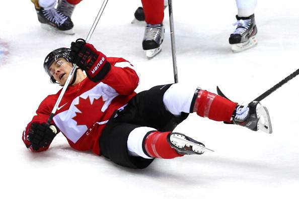 Chris Kunitz #14 of Canada falls to the ice in front of the net of Lars Haugen #30 of Norway during the Men’s Ice Hockey Preliminary Round Group B game on day six of the Sochi 2014 Winter Olympics at Bolshoy Ice Dome on February 13, 2014 in Sochi, Russia. Kunitz has been held off the scoreboard so far in Sochi.