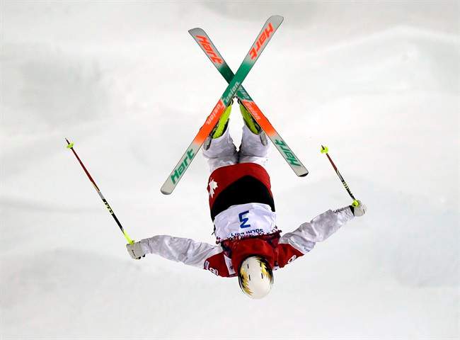 Canada's Chloe Dufour-Lapointe jumps during qualifying in the women's moguls at the Rosa Kutor Exreme Park ahead of the 2014 Winter Olympics, Thursday, Feb. 6, 2014, in Krasnaya Polyana, Russia.