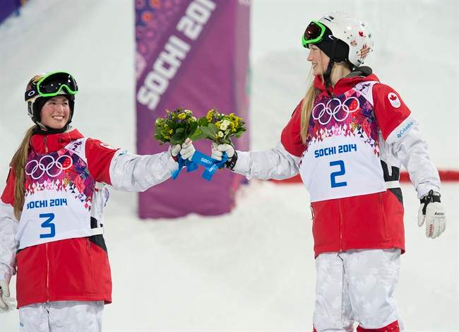 Canada’s Justine Dufour-Lapointe (right) celebrates with her sister Chloe Dufour-Lapointe after winning the gold and silver medal respectively.