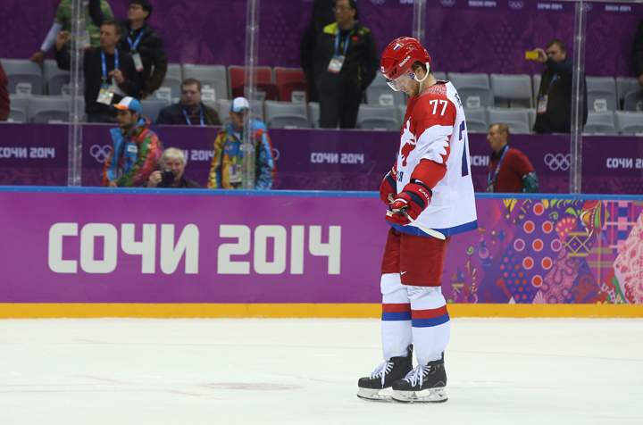 Anton Belov #77 of Russia leaves the ice after Finland defeated Russia 3-1 during the Men’s Ice Hockey Quarterfinal Playoff on Day 12 of the 2014 Sochi Winter Olympics at Bolshoy Ice Dome on Feb. 19, 2014 in Sochi, Russia. (Photo credit: Bruce Bennett/Getty Images)