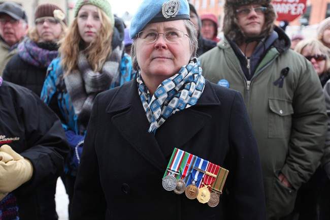 Ret. Sergeant Major Rene Bell gathers with other veterans at a Veterans Affairs Office in Brandon, Manitoba, on Friday, January 31, 2014. 