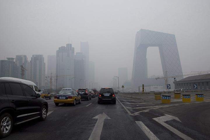 Cars clog in the traffic in Beijing’s Central Business District on a hazy day, Friday, Feb. 21, 2014. (AP Photo/Alexander F. Yuan)