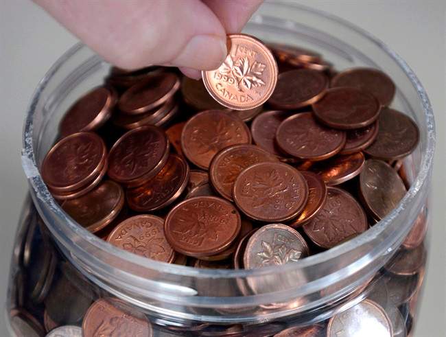A household penny jar is shown in Montreal, Monday, February 4, 2013. 