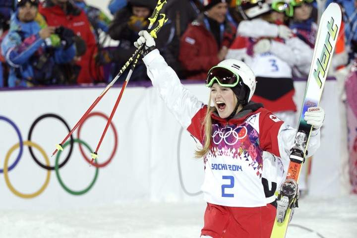 Canada's Justine Dufour-Lapointe celebrates after winning the gold medal in the women's moguls at the 2014 Winter Olympics, Saturday, Feb. 8, 2014, in Krasnaya Polyana, Russia.