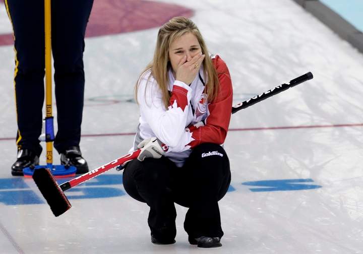 Canadas skip Jennifer Jones reacts after delivering the last rock to defeat Sweden in the women’s curling gold medal game.