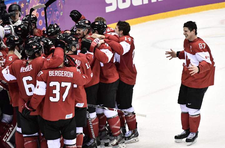 Team Canada celebrates their 3-0 win over Sweden.