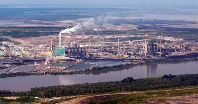 An oilsands mine facility sites along the Athabasca river near Fort McMurray, Alta., in a July 10, 2012 photo.