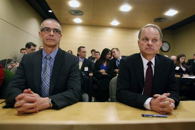 Michel Columbe (left), Head of the Canadian Security Intelligence Service(CSIS)and John Forster (right), Chief of Communications Security Establishment Canada(CSEC)prepare to appear before the Senate National Security and Defence committee in Ottawa, Monday February 3, 2014. 