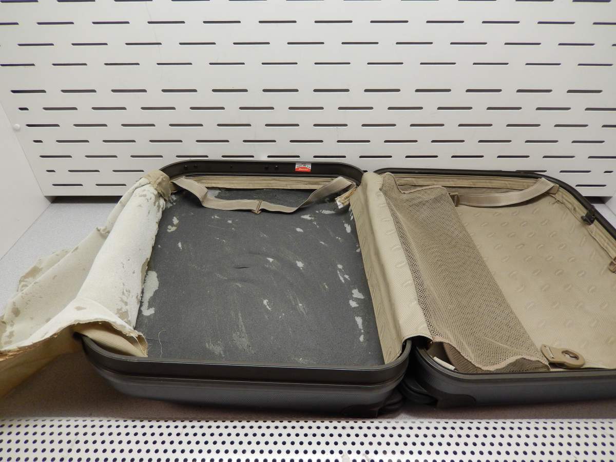 Seized suspected heroin and false-bottom suitcases used to conceal the narcotics.