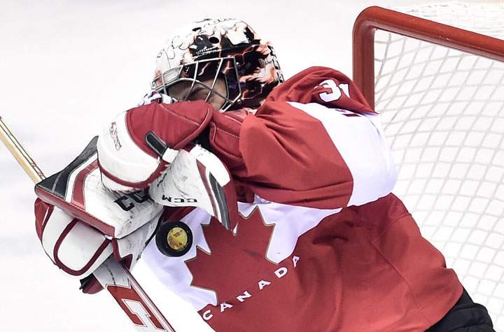 Canada goalie Carey Price makes a save against Sweden during second period action.