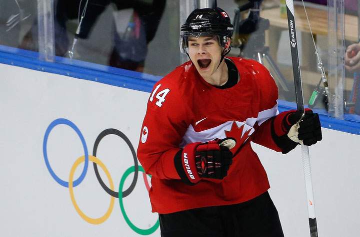 Chris Kunitz of Canada (14) celebrates his goal against Sweden during the third period of the men's gold medal hockey game.