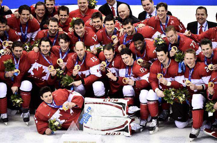Team Canada poses for their team photo after defeating Sweden in the men's hockey gold medal game.