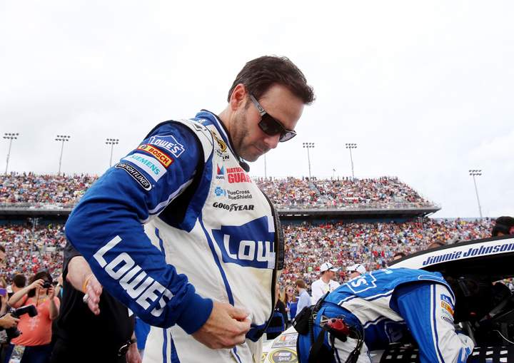  Jimmie Johnson takes part in pre-race ceremonies for the NASCAR Sprint Cup Series Daytona 500 at Daytona International Speedway on February 23, 2014 in Daytona Beach, Florida.
