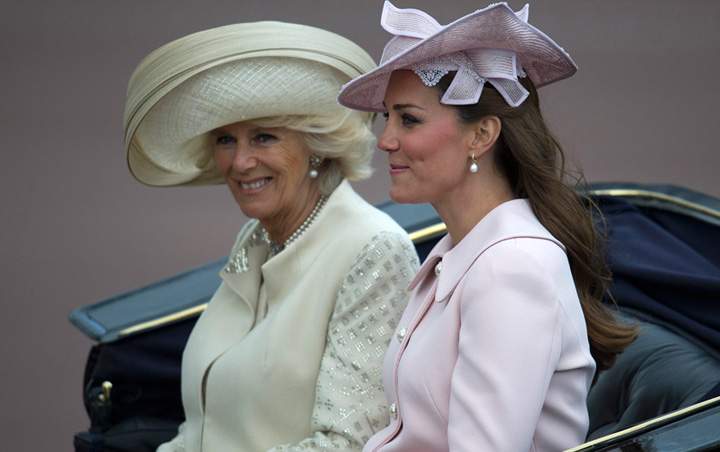 File photo of Catherine, Duchess of Cambridge (R) and Camilla, Duchess of Cornwall, following the Queen’s Birthday Parade, ‘Trooping the Colour,’ at Horse Guards Parade in London on June 15, 2013.