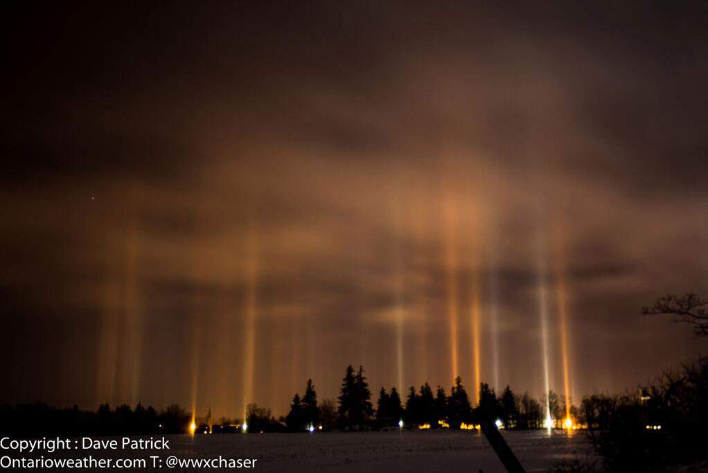 Lights from the ground that are reflected into the night sky are sent back down to their source via ice crystals, creating beautiful light pillars.