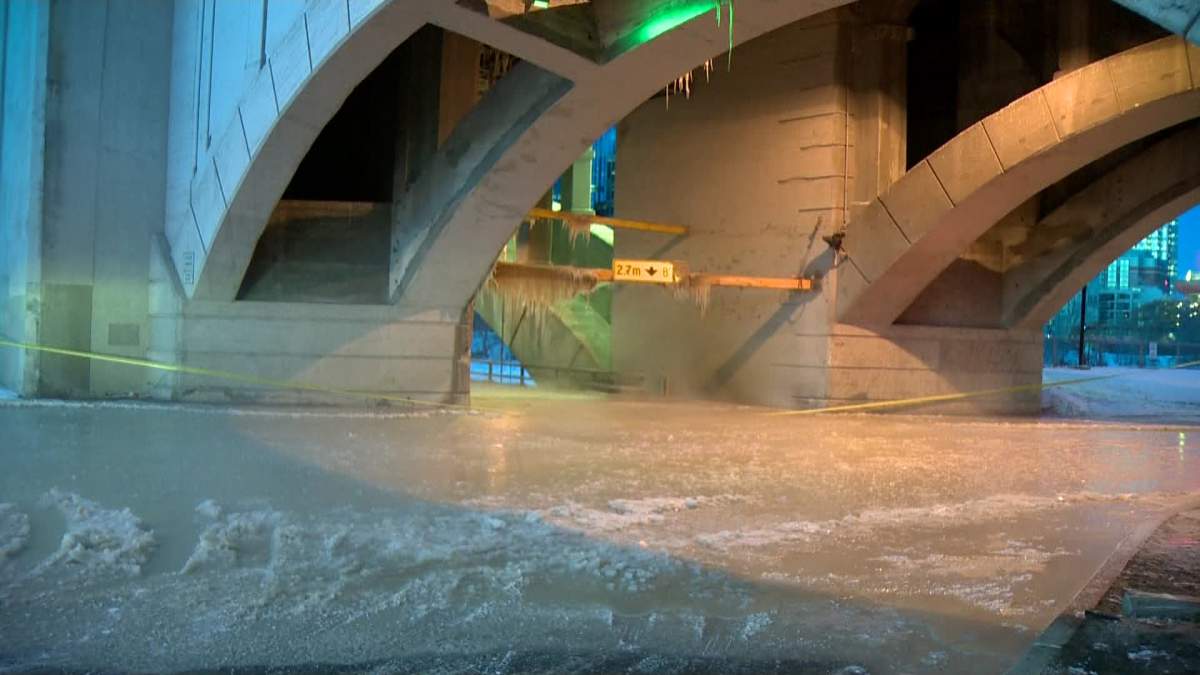 Ice covers Memorial Drive after a water main break on Monday, February 24, 2014.