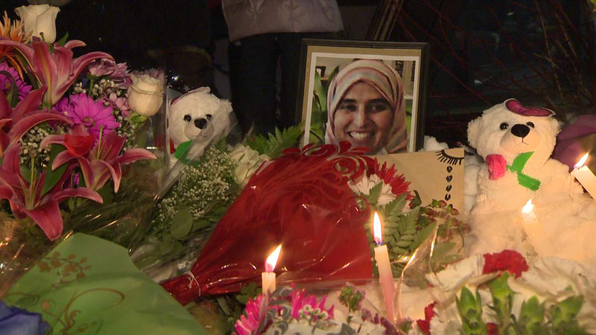 People lit candles and put flowers in front of the Fabre metro to commemorate the life of Naima Rharouiti on Sunday, February 2, 2014.