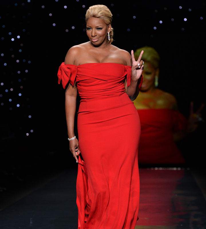 Nene Leakes presents a dress by Dolce & Gabbana during The Heart Truth Red Dress Collection show sponsored by the American Heart Association Go Red For Women campaign February 6, 2014 in New York.
