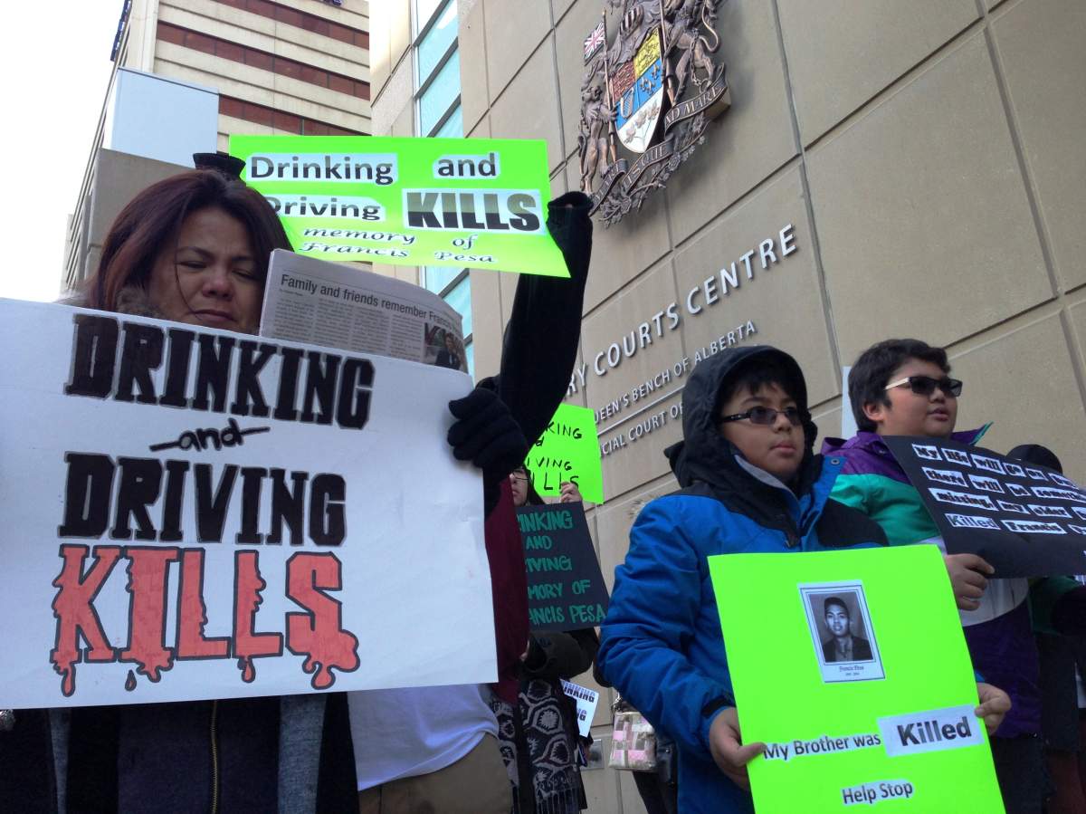 Family and friends of Francis Pesa gathered at the Calgary Courts Centre on January 19, 2014 to launch an awareness campaign.