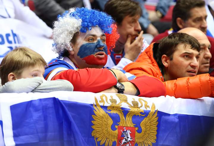 Russian fans watch the Men’s Ice Hockey Quarterfinal Playoff against Finland on Feb. 19, 2014 in Sochi, Russia. (Photo credit: Martin Rose/Getty Images)