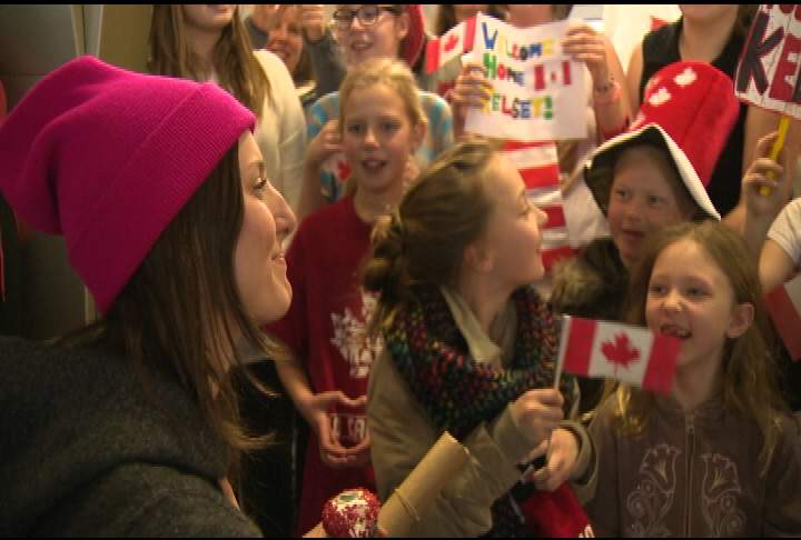 Silver medalist helping others - image