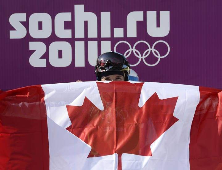 Silver Medallist, Canada’s Dominique Maltais celebrates in the Women’s Snowboard Cross Final at the Rosa Khutor Extreme Park during the Sochi Winter Olympics on February 16, 2014. (Franck Fife/AFP/Getty Images)