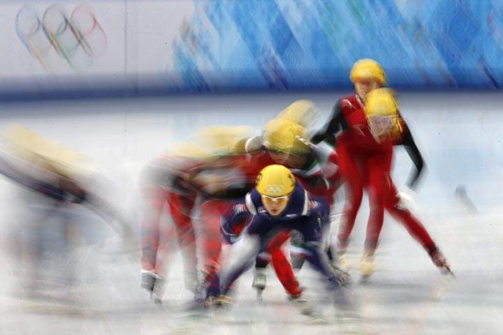 Skaters compete in the Women’s Short Track 3000 m Relay Final at the Iceberg Skating Palace during the Sochi Winter Olympics on February 18, 2014. (ADRIAN DENNIS/AFP/Getty Images)